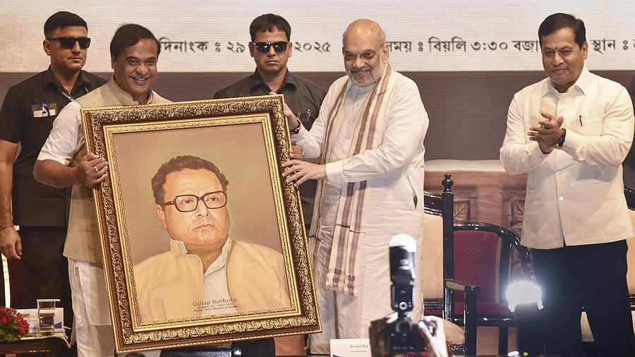 <div class="paragraphs"><p>Amit Shah being felicitated with a portrait of former Assam CM Golap Borbora by Assam Chief Minister Himanta Biswa Sarma.&nbsp;</p></div>