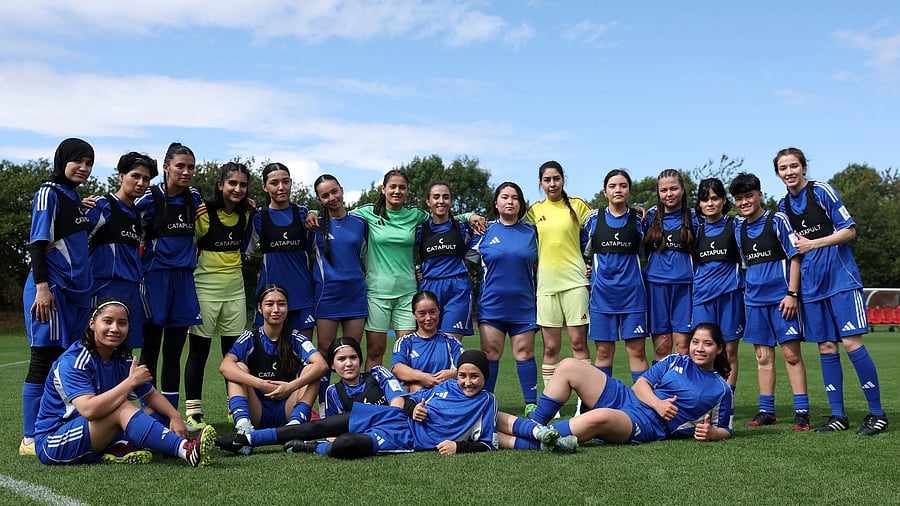 <div class="paragraphs"><p>Members of the Afghan Women's Refugee team pose for a team group during a selection camp at St. George's Park, Burton upon Trent, Britain.</p></div>