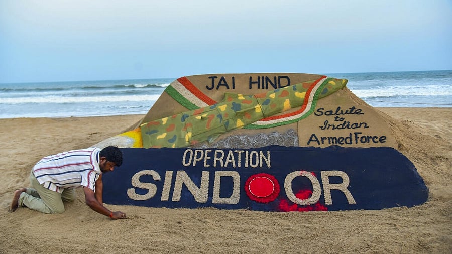 <div class="paragraphs"><p>Sand artist Sudarsan Pattnaik creates a sand sculpture celebrating the Indian armed forces' missile strikes on terror targets in Pakistan and Pakistan-occupied Kashmir (PoK) under 'Operation Sindoor', in retaliation to the Pahalgam terror attack, at Puri beach, Odisha, Thursday, May 8, 2025.</p></div>