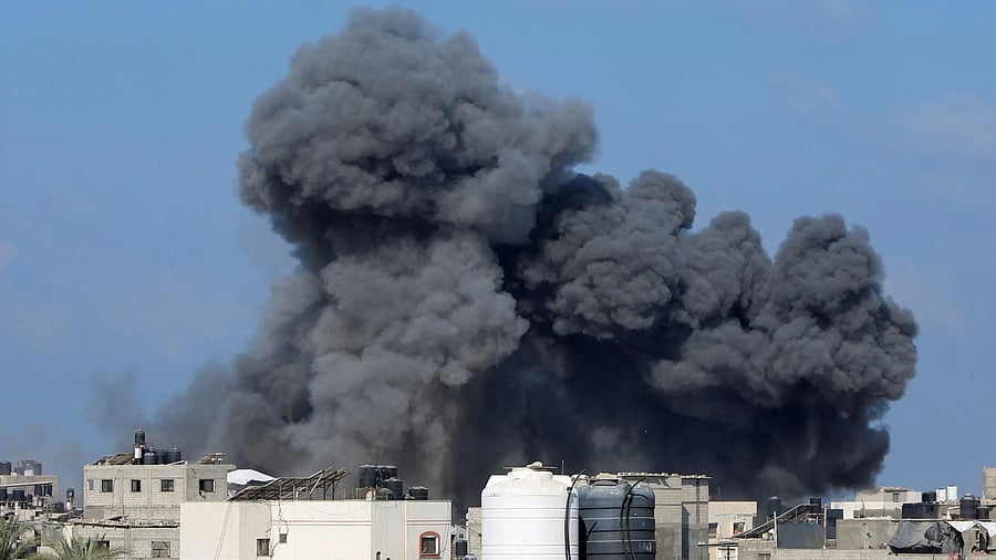 <div class="paragraphs"><p>Smoke rises following an Israeli strike</p></div>