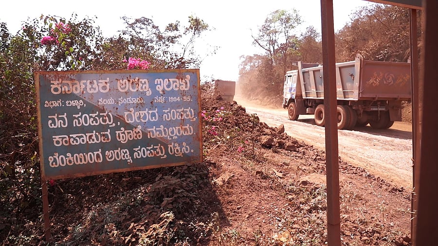 A signboard placed by the forest department says thatforest wealth is nation’s wealth and that is everyone’sresponsibility to protect it. The board is en route to the mining areas in Swamimalai forest division in Sandur taluk of Ballari district.