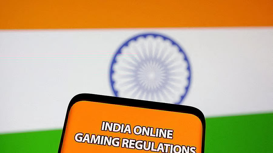 <div class="paragraphs"><p>The words 'India online gaming regulations' are displayed in front of an Indian flag.</p></div>