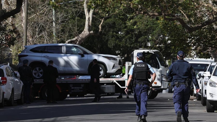 <div class="paragraphs"><p>Police officers oversee the loading of a car with a smashed window onto a flatbed truck after it crashed into the Russian consulate in Sydney, Australia, September 1, 2025.</p></div>
