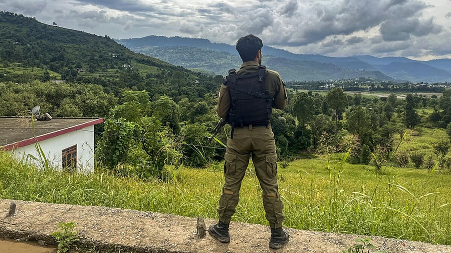 <div class="paragraphs"><p>A security official stands guard amid a cordon and search operation (CASO) along the border belt across 11 localities following reports of suspicious movement, in Poonch district, Jammu and Kashmir.</p></div>