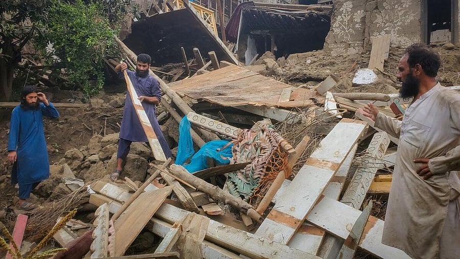 <div class="paragraphs"><p>Afghan men search for their belongings amidst the rubble of a collapsed house after a deadly magnitude-6 earthquake that struck Afghanistan around midnight, in Dara Mazar, in Kunar province, Afghanistan, September 1, 2025.</p></div>