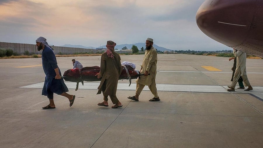 <div class="paragraphs"><p>People carry an earthquake victim on a stretcher to an ambulance at an airport in Jalalabad, Afghanistan, September 1, 2025.</p></div>