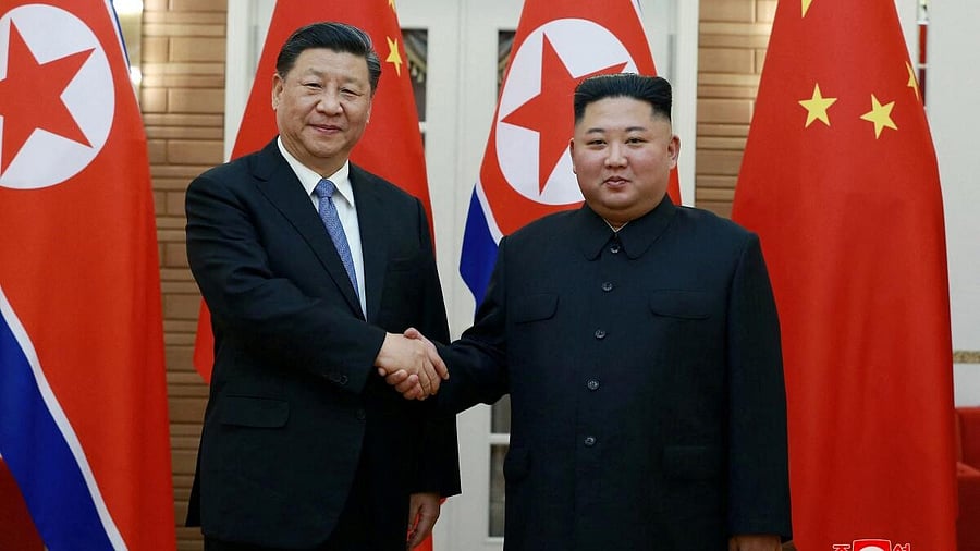 <div class="paragraphs"><p>File Photo: North Korean leader Kim Jong Un shakes hands with China's President Xi Jinping. </p></div>