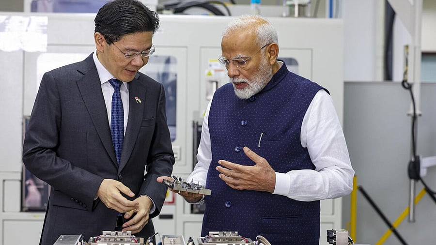 <div class="paragraphs"><p>Prime Minister Narendra Modi with his Singapore counterpart Lawrence Wong during their visit to AEM Holdings Ltd., in Singapore.</p></div>