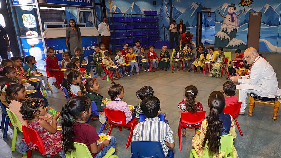 <div class="paragraphs"><p>Amit Shah with children of Anganwadi centres of his Lok Sabha Constituency at a gaming zone</p></div>