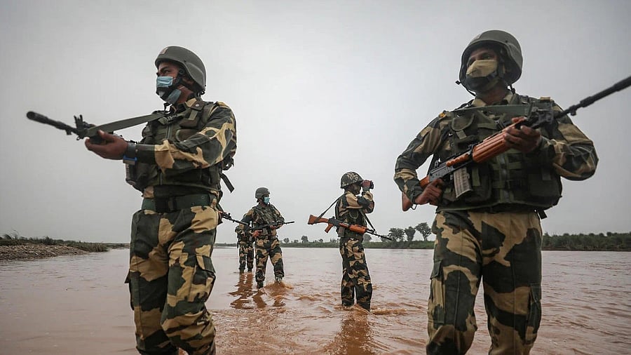 <div class="paragraphs"><p>Border Security Force personnel patrol a flooded area near the International Border in Samba district of Jammu and Kashmir.</p></div>