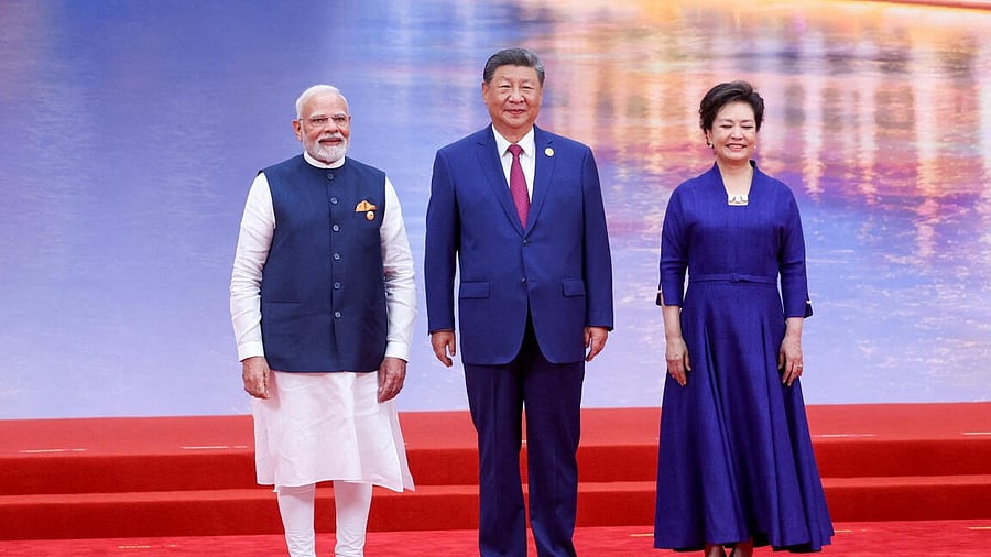 <div class="paragraphs"><p>Prime Minister Narendra Modi, Chinese President Xi Jinping and his wife Peng Liyuan pose at a welcome banquet for the Shanghai Cooperation Organization (SCO) Summit, in Tianjin, China.</p></div>