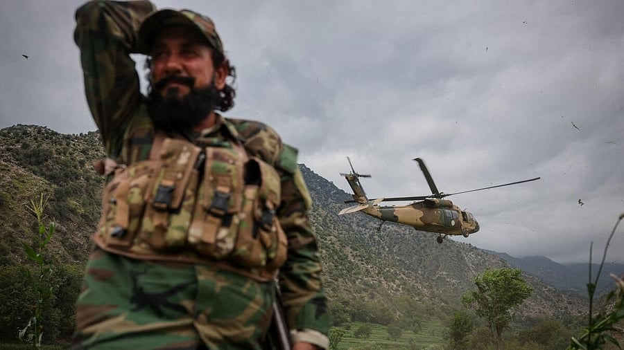 <div class="paragraphs"><p>A Taliban military helicopter carries medical and food supplies for the victims of a deadly magnitude-6 earthquake that struck Afghanistan.</p></div>