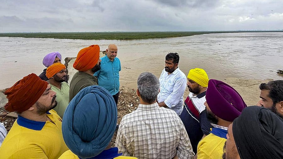<div class="paragraphs"><p>AAP in-charge of Punjab Manish Sisodia during a visit to a flood-hit village, in Tarn Taran district, Punjab.</p></div>