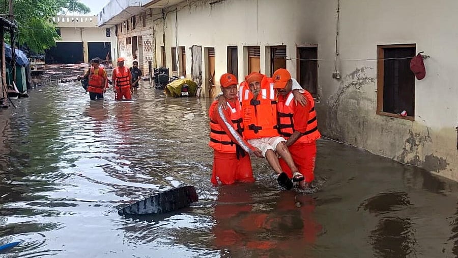 <div class="paragraphs"><p>NDRF personnel rescue a local from a flood-hit area in Punjab.</p></div>