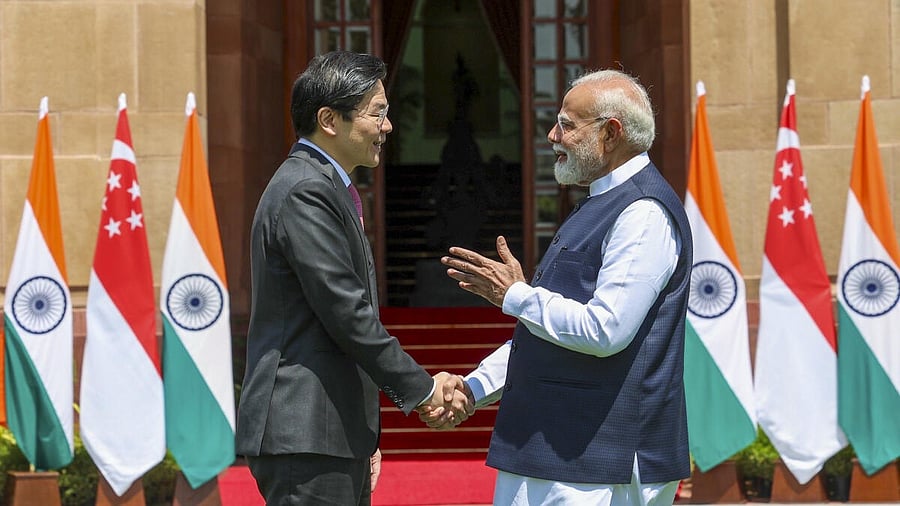 <div class="paragraphs"><p>Prime Minister Narendra Modi shakes hands with Singapore’s Prime Minister Lawrence Wong at Hyderabad House, in New Delhi.</p></div>