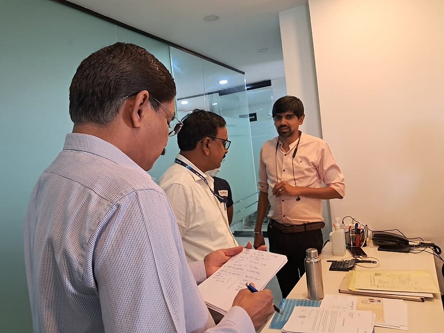 <div class="paragraphs"><p>District Health Officer Shanmukhappa and District Surveillance Officer G D Raghavan inspect documents during the raid on a hair transplant clinic in Davangere on Thursday.<strong>  </strong></p></div>