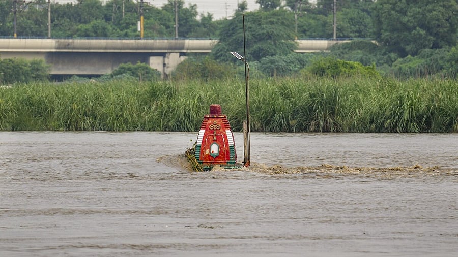 <div class="paragraphs"><p>The Yamuna river flows in spate partially submerging a temple near Yamuna Ghat, New Delhi, Friday, Sept. 5, 2025.</p></div>