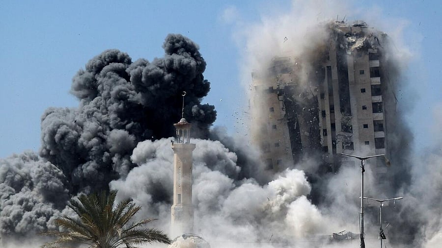 <div class="paragraphs"><p>Smoke rises as a building hit by an Israeli air strike collapses, in Gaza City, September 5, 2025.</p></div>