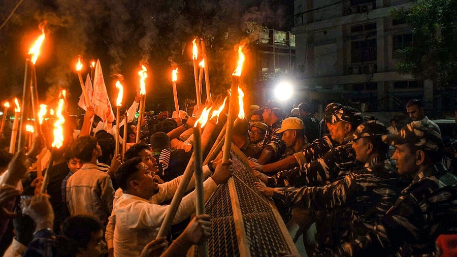 <div class="paragraphs"><p>Security personnel try to stop activists of All Assam Students Union (AASU) during a protest march after the central government notified the rules for implementation of the Citizenship (Amendment) Act, 2019, in Nagaon district, Tuesday, March 12, 2024. </p><p></p></div>