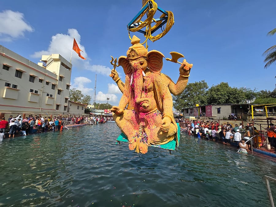 <div class="paragraphs"><p>The idol of Lord Ganesh installed by Sarvajanik Ganesh Utsav Mandal at Mali Galli being immersed at Kapileshwar tank in Belagavi with the help of a crane on Saturday.</p></div>