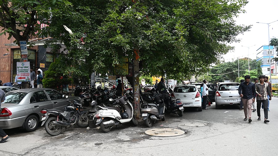 <div class="paragraphs"><p>At 27th Cross, Banashankari II Stage, footpaths have become permanent parking spaces.</p></div>