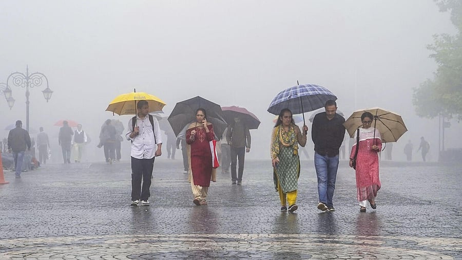 <div class="paragraphs"><p>People walk down a road on a misty afternoon during rain, in Shimla, Himachal Pradesh, Saturday, Sept. 6, 2025.</p></div>