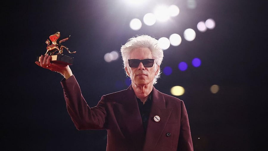 <div class="paragraphs"><p>Jim Jarmusch poses with the Golden Lion for Best Film for 'Father Mother Sister Brother' during the 82nd Venice International Film Festival</p></div>