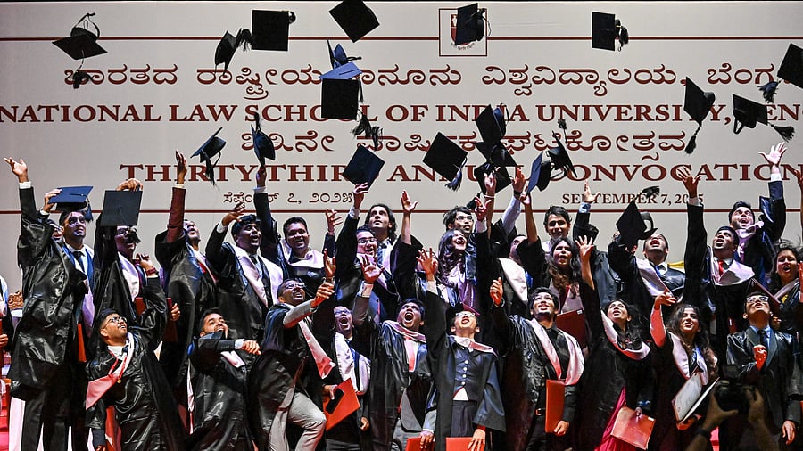 <div class="paragraphs"><p>Graduating students celebrate with a joyful cap toss at the National Law School of India University (NLSIU) on Sunday. </p></div>