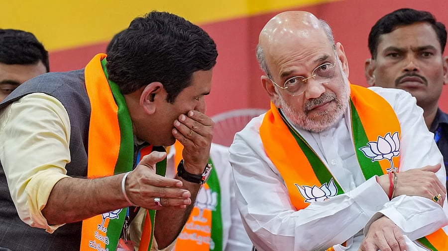 <div class="paragraphs"><p>Union Home Minister Amit Shah with Karnataka President B Y Vijayendra </p></div>