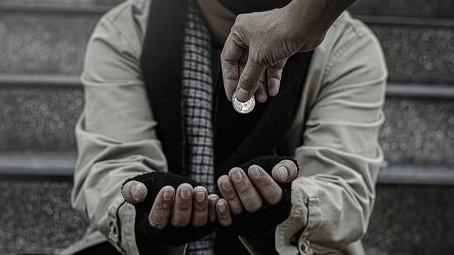 <div class="paragraphs"><p>A person giving alms to a beggar. Representative image.</p></div>