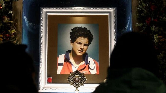 <div class="paragraphs"><p>Worshippers stand before a relic of Carlo Acutis, a British-born Italian boy who became the first millennial Catholic saint, as they attend a Holy Mass celebrating his canonisation, at Parish Saint Carlo Acutis. Image for representational purpose.</p></div>