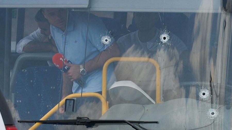 <div class="paragraphs"><p>People inspect a bus with bullet holes at the scene where a suspected shooting attack took place at the outskirts of Jerusalem, September 8, 2025</p></div>