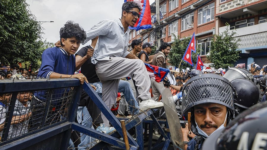 <div class="paragraphs"><p>A student crosses a barricade during a protest over alleged corruption and Nepal government’s decision to ban social media sites, in Kathmandu, Monday, Sept. 8, 2025. The government later announced the withdrawal of the decision.</p></div>