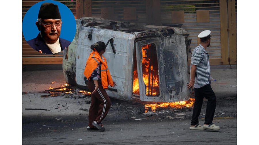 <div class="paragraphs"><p>A couple walks past a vehicle torched by demonstrators near the Parliament. Inset:&nbsp;Former Nepal Prime Minister K P Sharma Oli.</p></div>