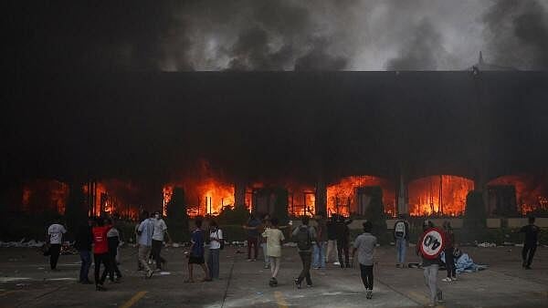 <div class="paragraphs"><p>A fire burns inside the Parliament complex during a protest in Kathmandu.</p></div>