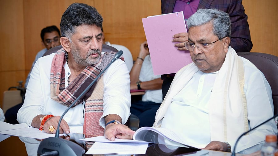 <div class="paragraphs"><p>Karnataka Chief Minister Siddaramaiah and his deputy D K Shivakumar at a meeting with Congress legislators from Bengaluru.</p></div>