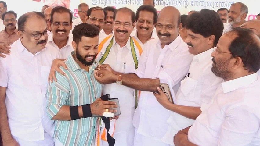 <div class="paragraphs"><p>V S Sujith being gifted with gold chain and ring by party leaders.</p></div>