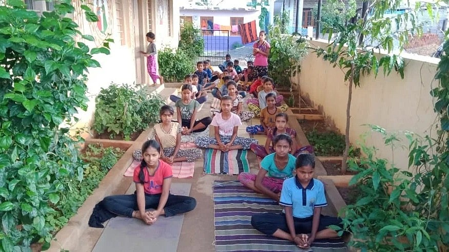 Students of Papanashi village engage in their regular yoga session.