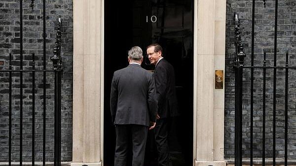 <div class="paragraphs"><p>British Prime Minister Keir Starmer and Israeli President Isaac Herzog enter 10 Downing Street, in London, Britain.</p></div>