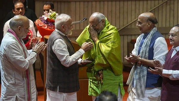 <div class="paragraphs"><p>Prime Minister Narendra Modi felicitates Maharashtra Governor C P Radhakrishnan.</p></div>