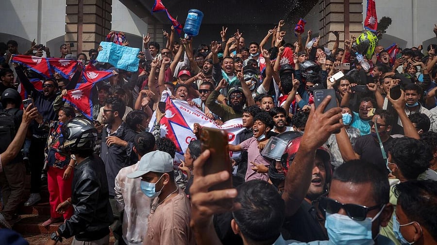 <div class="paragraphs"><p>Demonstrators celebrate at the Parliament complex during a protest against Monday's killing of 19 people after anti-corruption protests that were triggered by a social media ban, which was later lifted, during a curfew in Kathmandu, Nepal.</p></div>