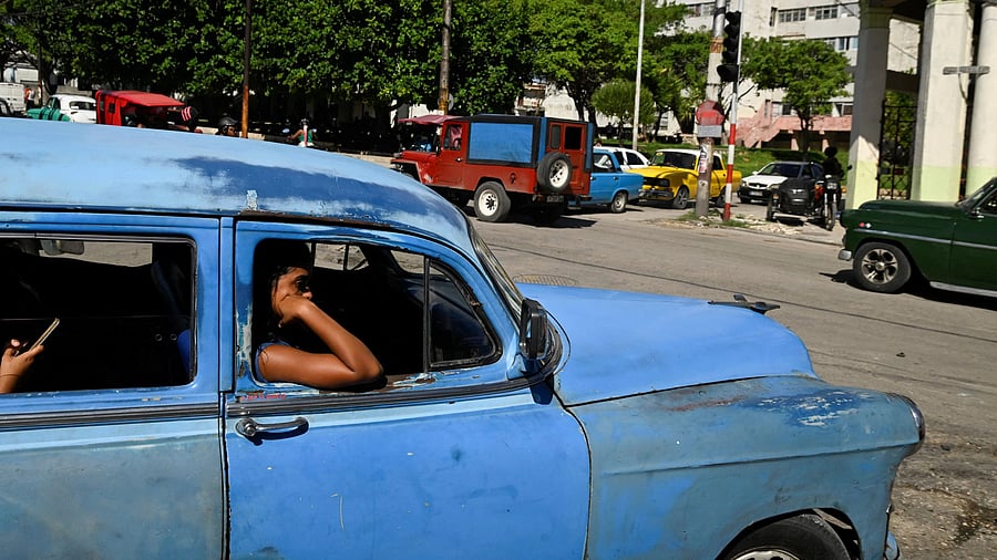 <div class="paragraphs"><p>People ride in a classic car during a national power grid collapse, for the fourth time in less than a year, which caused a nationwide blackout, in Havana, Cuba.</p></div>