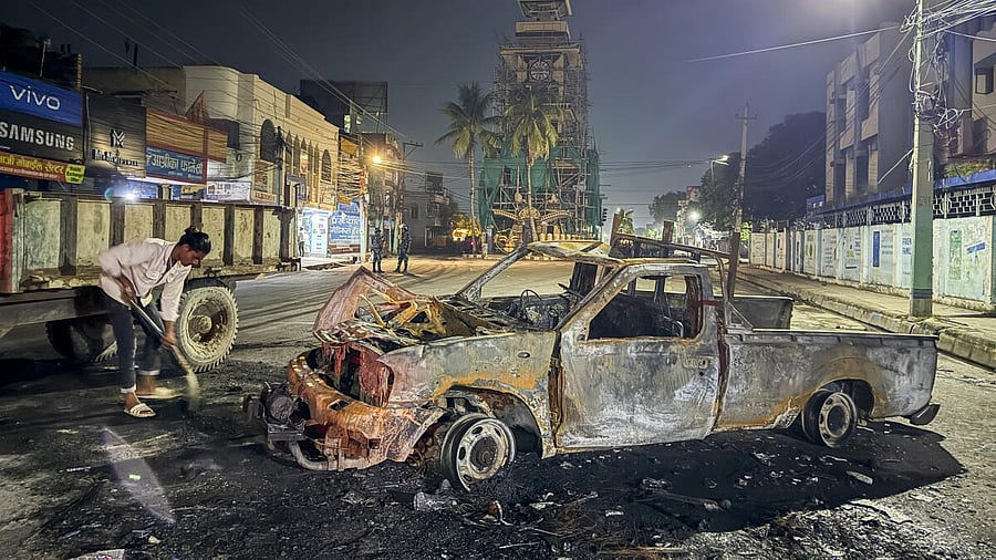 <div class="paragraphs"><p>Charred remains of a vehicle on a road in the aftermath of anti-government protests, in Birgunj, Nepal.</p></div>