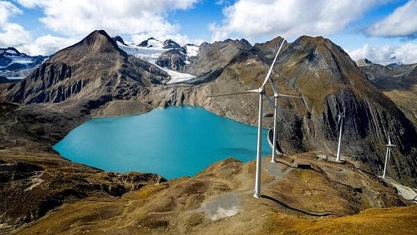 <div class="paragraphs"><p>A drone view shows the windmills, the Gries dam and the Gries Glacier near the Nufenen Pass in Obergoms, Switzerland.</p></div>