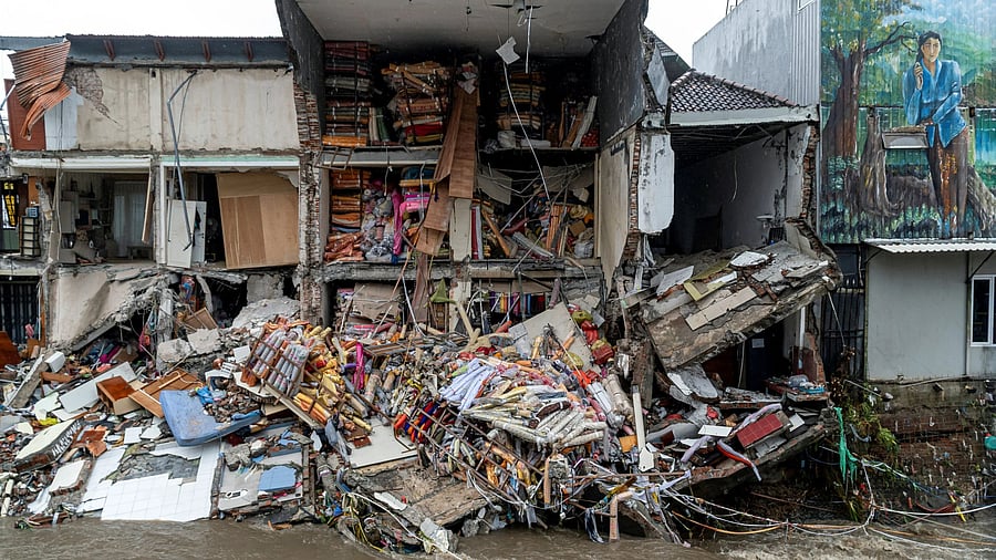 <div class="paragraphs"><p>Goods lie scattered at a fabric store that collapsed after being hit by floods following overnight heavy rains in Denpasar, Bali, Indonesia September 10, 2025. </p></div>