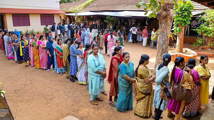<div class="paragraphs"><p>Voters wait in a queue at a polling station in Kerala.</p></div>