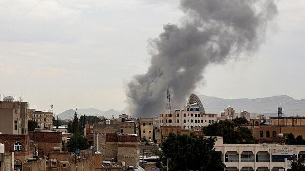 <div class="paragraphs"><p>Smoke billows following an Israeli airstrike in Sanaa, Yemen.</p></div>