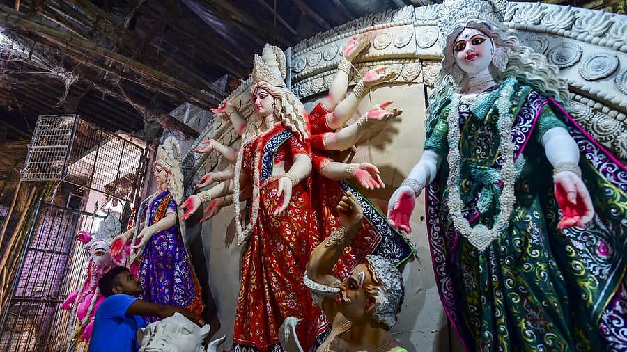 <div class="paragraphs"><p>An artisan works on an idol of Goddess Durga at a workshop ahead of Durga Puja festival, in Prayagraj, Uttar Pradesh, Friday, Sept. 12, 2025.</p></div>