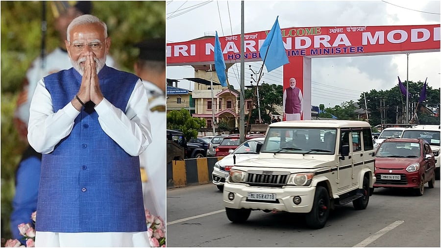 <div class="paragraphs"><p>Prime Minister Narendra Modi(L), a sign welcoming PM in Imphal. </p></div>