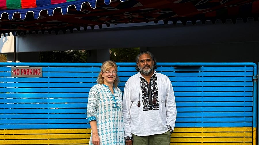 <div class="paragraphs"><p>Menon and his wife Natalia outside the gate of their home in Ernakulam, Kerala.</p></div>